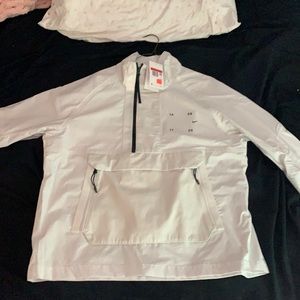 A white Nike windbreaker